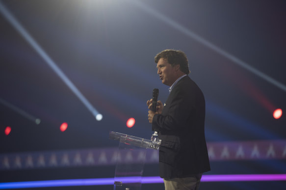 Tucker Carlson, former host of Tucker Carlson Tonight on Fox News, speaks during AmericaFest at Phoenix Convention Centre last year.