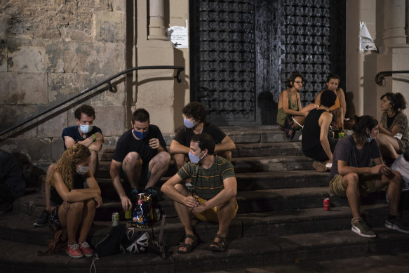 Barcelona's bars and clubs have been restricted, but young people are gathering in the streets instead.