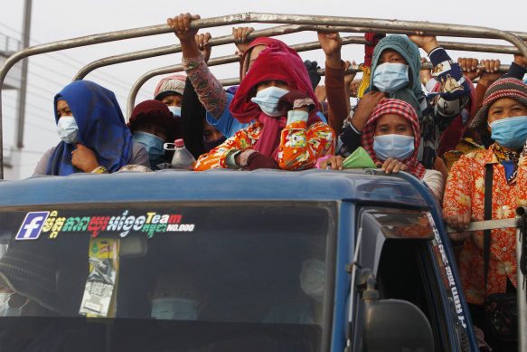 Cambodian garment workers head to work outside Phnom Penh in May following a lockdown. 