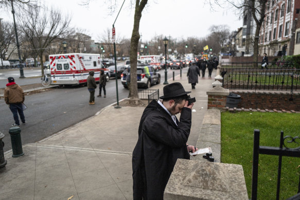 Dov Markovitch, of Kyiv, Ukraine, prays outside the closed Synagogue.