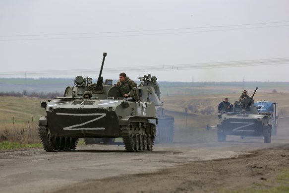 Russian military vehicles move on a highway in an area controlled by Russian-backed separatist forces near Mariupol, Ukraine.