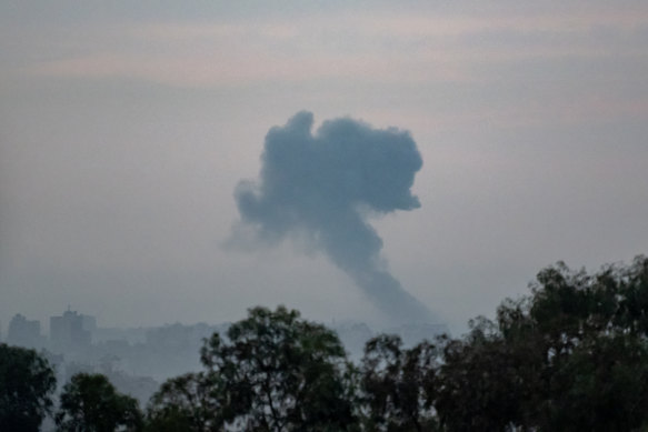 An upcoming Israeli military attack on buildings in Gaza City as seen from the border area on October 31 in Sderot, Israel.