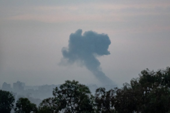 An incoming Israeli military strike on buildings in Gaza City, as seen from the border area on October 31 in Sderot, Israel.