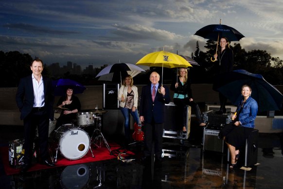 Robert Albert (holding yellow umbrella) with members of his family. 