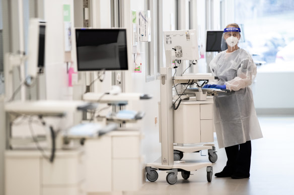 A paediatric nurse helps prepare extra beds at the Monash Medical Centre on Wednesday.