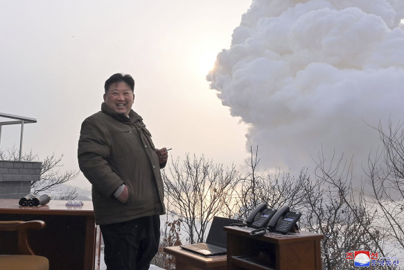 Kim Jong-un supervises a test of a “high-thrust solid-fuel motor” at the Sohae Satellite Launching Ground in North Korea on December 15, 2022. Independent journalists were not given access to cover the event depicted in this image distributed by the North Korean government. 