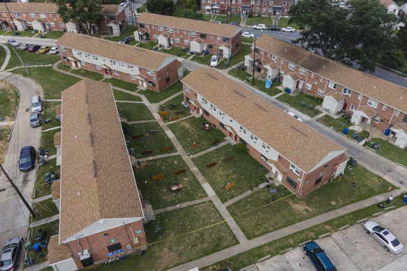 Debris and overturned tables remain after the mass shooting at a block party in Baltimore on July 2.