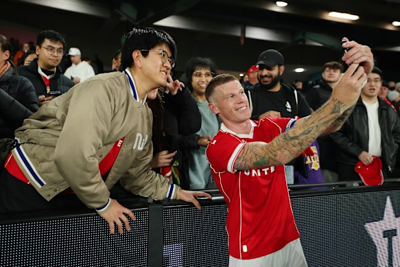 James McClean takes a selfie with fans after his side’s clash at Marvel Stadium.