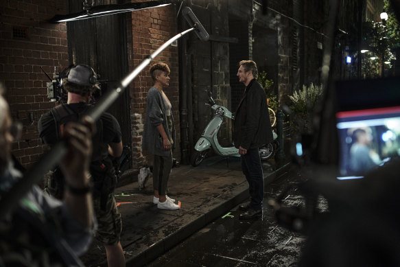 Emmy Raver-Lampman, as journalist Mira Jones, and Neeson shoot a scene in Highlander Lane, Melbourne.  
