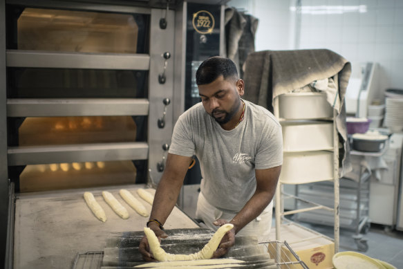 Tharshan Selvarajah, the 2023 winner of the “Grand Prize of the Traditio<em></em>nal French Baguette,” at his bakery, “Au levain des Pyrénées”, in Paris.
