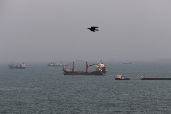 Ships pictured anchored in the Strait of Hormuz on August 10.