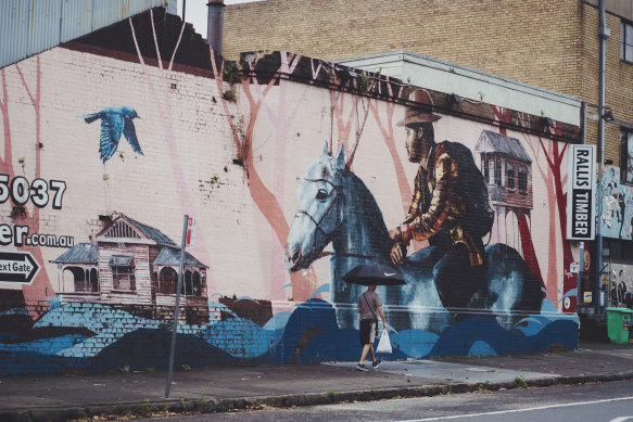 Industrial, creative, gritty: A mural in Marrickville, near the Sydenham train station.