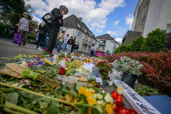 Flowers and candles near the site of Friday’s attack that left three people dead and eight injured in Solingen, Germany.