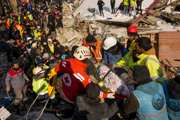 Hatice Korkut, 82, is rescued alive from her destroyed building in Elbistan, Turkey. 