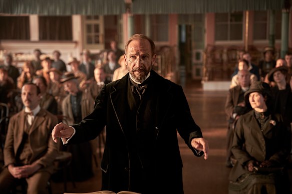 Ralph Fiennes as Dr Guthrie, recruited to direct a Yorkshire mill town’s annual music society production during World War I.