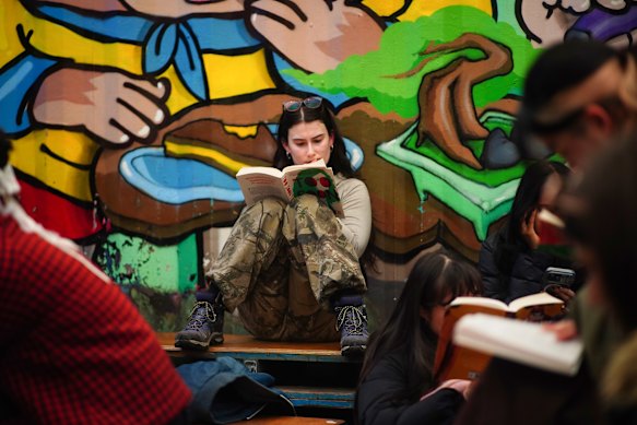 Fun day out: Ciara Thompson reading a novel at Section 8 bar in Chinatown.