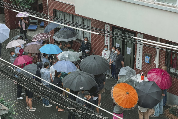 In this photo by Weronika Truszczynska, residents of a compound banded together to complain to their community about opening up in Shanghai. 