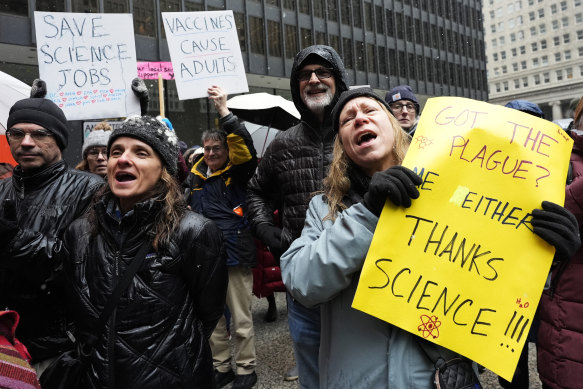 People protest the Trump administration’s science policies and federal job cuts in Chicago.