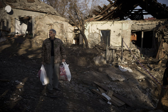 Anatolii Kaharlytskyi, 73, stands near his house, heavily damaged after a Russian attack in Kyiv.