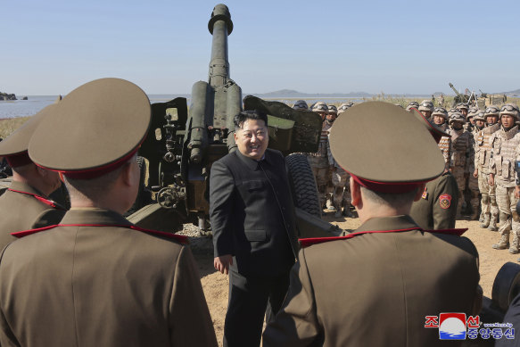 In this undated photo provided by the North Korean government, North Korean leader Kim Jong Un watches an artillery exercise at an undisclosed place in North Korea. 