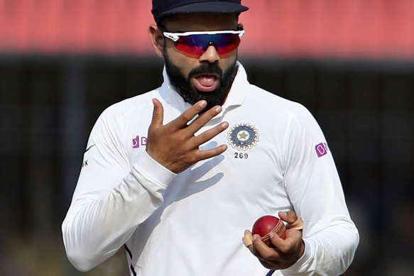 India's captain Virat Kohli shines the ball during the Test match against Bangladesh last year.