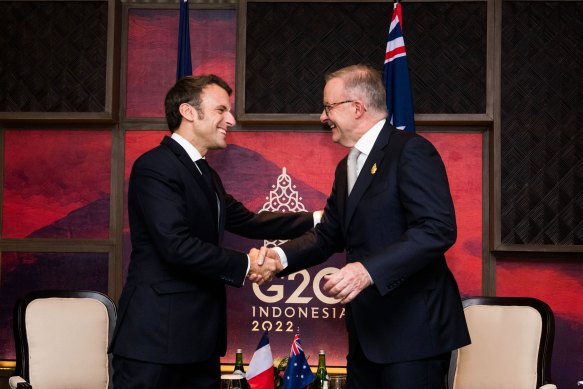 French President Emmanuel Macron was happy to gladhand Anthony Albanese but he is still critical  of the AUKUS pact. 