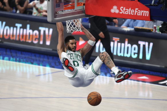 Jayson Tatum #0 of the Boston Celtics dunks the ball.