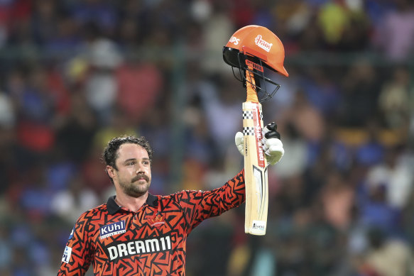 Travis Head celebrates his century.