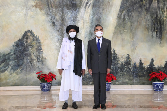 Taliban co-founder Abdul Ghani Baradar, left, and Chinese Foreign Minister Wang Yi in Tianjin, China, on July 28.