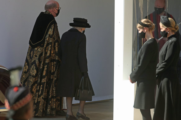 The Dean of Windsor, the Queen, Lady Louise Windsor and the Countess of Wessex follow the procession at the Galilee Porch at St George’s Chapel during the funeral of Prince Philip.