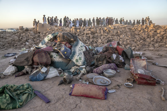 Afghan men search for victims after an earthquake in Zenda Jan district in Herat province, of western Afghanistan.