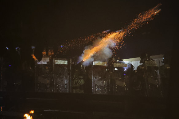 Riot police fire tear gas during clashes with students at the Chinese University of Hong Kong.