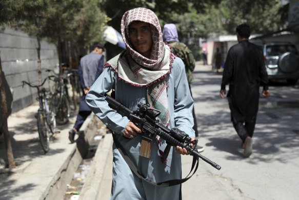 A Taliban fighter at a checkpoint in the Wazir Akbar Khan neighbourhood of Kabul on Sunday.