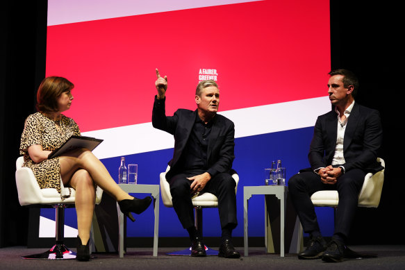 Shadow culture secretary Lucy Powell, Labour leader Sir Keir Starmer (centre) and former England football player Gary Neville on day two of the Labour Party Conference.