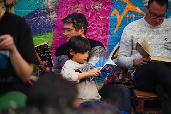 Reading as a social activity: Ian Koslow brought his son Aidan, 7, to Book Doof.