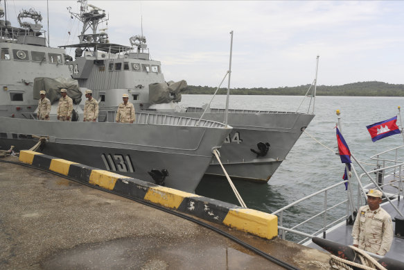 Cambodian navy crew members stand on a navy patrol boat at the Ream Naval Base in Sihanoukville, south-west of Phnom Penh, Cambodia.