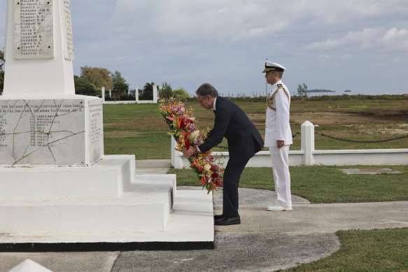US Secretary of State Antony Blinken, left, attends a wreath-laying ceremony at Tonga’s War Memorial in Nuku’alofa, Tonga.