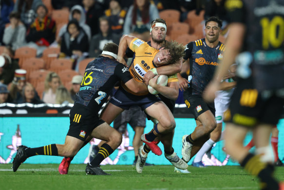 Bayley Kuenzle of the Brumbies is tackled during the round two Super Rugby Trans-Tasman match between the Chiefs and the ACT Brumbies at FMG Stadium.