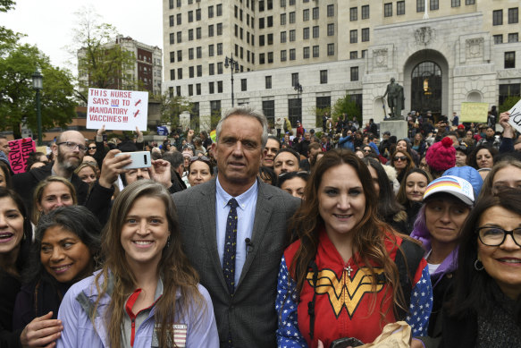 Kennedy posing with the crowd at an anti-vaccine rally in Albany in 2019.