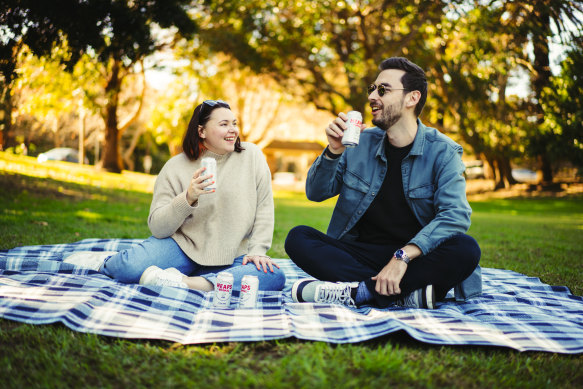 Lauran Vohmann enjoying non-alcoholic beer Heaps Normal with her partner Alistair Brown at Brennan Park in Wollstonecraft. 