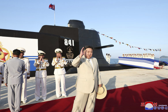 Kim Jong-un attends a launching ceremony of North Korea says a new nuclear attack submarine in September.