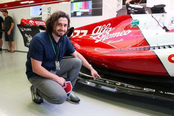 JigSpace chief executive Zac Duff points to his company’s mini logo on Alfa Romeo’s car.