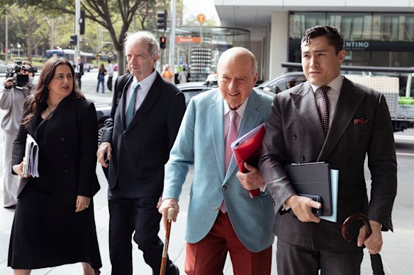 Alan Jones and his legal team arrive at court on Thursday.