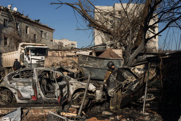 Ukrainian emergency personnel work at the scene of a Russian Iskander ballistic missile attack on a residential building in the Kyivskyi district of Kharkiv, Ukraine.