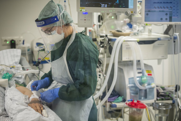 A nurse looks after a COVID-19 patient in the intensive care unit of a hospital in Essen, Germany this week.