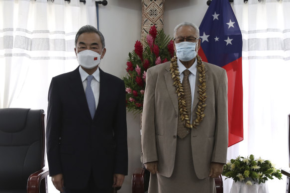 Samoa’s Head of State Tuimalealiifano Sualauvi Vaaletoa II meets with China’s Foreign Minister Wang Yi in Apia on Saturday.