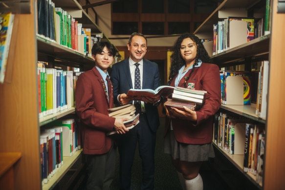 Secretary of the NSW Education Department, Murat Dizdar, with year 12 students Hongouy Oum and Michelle Pani at Cabramatta High School.