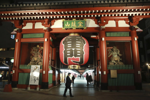 Visitors stroll at Kaminarimon gate in the Asakusa district in Tokyo in 2021.