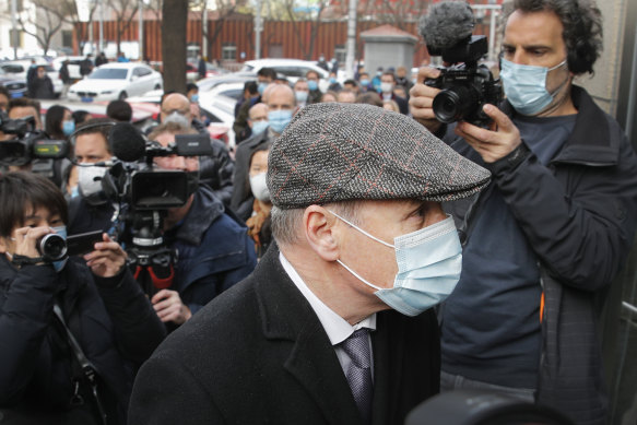 Jim Nickel, the deputy chief of mission for the Canadian Embassy in China, is mobbed by reporters as he arrives at the court to attend former diplomat Michael Kovrig’s trial in Beijing, on Monday, March 22.