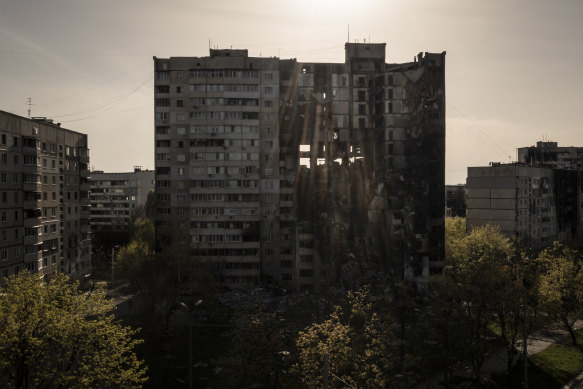 A building heavily damaged by multiple Russian bombardments stands near a frontline in Kharkiv, Ukraine.